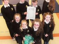 Gaelscoil Mhic Easmainn pupils with the Ireland flag and proclamation of independence that was given to them by the Irish Army were, front from left: Aimee Mhic Carthaigh, Ava Dewey, Robyn Nic Conmara and Ellie May Ni Riordain. Back: Saoirse Ni Mhaoldomhnaigh, Lucan O Ceallichain, Muiris O Conaill, Sorcha Ni Luansigh. Photo by Gavin O'Connor.