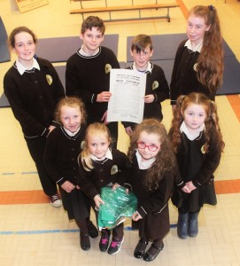 Gaelscoil Mhic Easmainn pupils with the Ireland flag and proclamation of independence that was given to them by the Irish Army were, front from left: Aimee Mhic Carthaigh, Ava Dewey, Robyn Nic Conmara and Ellie May Ni Riordain. Back: Saoirse Ni Mhaoldomhnaigh, Lucan O Ceallichain, Muiris O Conaill, Sorcha Ni Luansigh. Photo by Gavin O'Connor. 