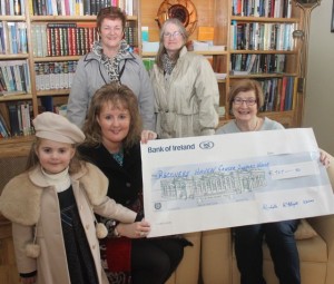 Presenting the cheque were Michelle McElligott to Maureen O'Brien of Recovery Haven. Also included are little Roisin Kerins, and at back Helen McElligott and Rose O'Callaghan. Photo by Dermot Crean