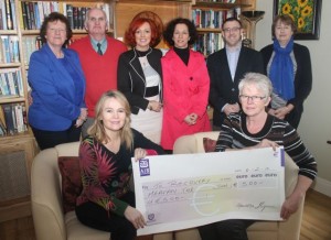 In front; Anne Kerins presents a cheque for €500 to Recovve