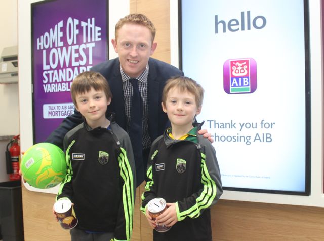 Colm Cooper with Mikey and Jack Corridon, Kilmoyley, at the fun day at AIB in Castle Street, Tralee, on Tuesday. Photo by Dermot Crean
