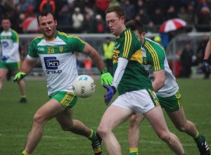 Colm Cooper about to tap over his second half point with Donegal's, Neil McGee in close quarters. Photo by Dermot Crean.