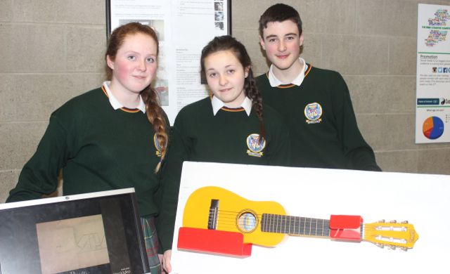 Killorglin Community College students Ava Griffin, Paula Naughton and Matthew O'Connell with Malava Guitar Stands at the County Final of the Kerry County Council Annual Student Enterprise Awards at IT Tralee on Friday. Photo by Dermot Crean