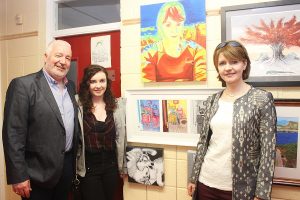 Diarmuid McElligott, Alana McElligott and Avril Hewitt at the art exhibition in Coláiste Gleann Lí. Photo by Gavin O'Connor.