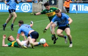Kerry's Paul Murphy and Dublin's John Small race for the ball, while Colm Cooper and Dublin's Philly McMahon. Photo by Dermot Crean