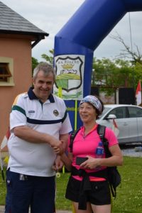 The first Ultra participant to complete the Ultra section of the DWC, Geraldine O'Sullivan from Bantry Athletic Club receiving her medal from club chairman, Terry Boyle. 