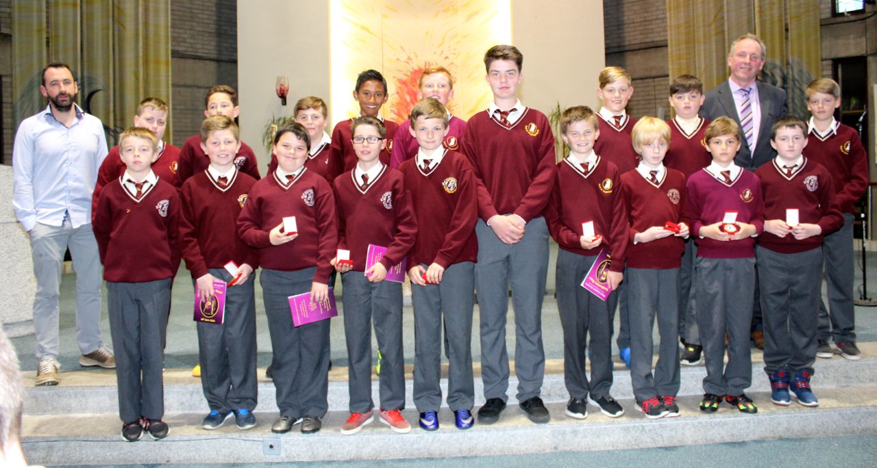 Mr Liam Moloney's Sixth Class pupils from Holy Family NS with Principal Ed O'Brien at the graduation Mass at Our Lady and St Brendan's Church on Tuesday night. Photo by Dermot Crean