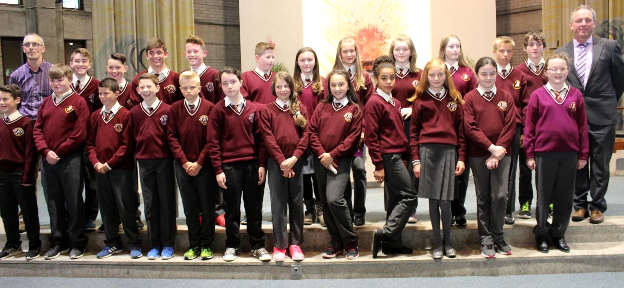 Mr Pat O'Connor's Sixth Class pupils from Holy Family NS with Principal Ed O'Brien at the graduation Mass at Our Lady and St Brendan's Church on Tuesday night. Photo by Dermot Crean