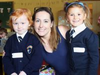 Caherleaheen National School Junior Infant pupils Saoirse Moynihan and Spphia Polak with teacher Adrian Heislip. Photo by Gavin O'Connor.