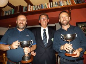 Michael Mercer, Captain of Castlegregory Golf Club, presenting the John Brown Memorial Scratch Cups to the overall winners, Colin O'Sullivan (left) intermediate and Richie Greer (right) junior.