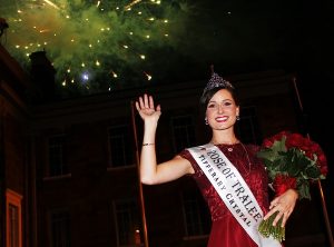Rose of Tralee , Maggie McEldowney, in front of the Ashe Memorial Hall with Midnight Madness in full flight. Photo by Gavin O'Connor. 