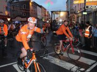 Participants in the Cycle Against Suicide make their way through town on Saturday night. Photo by Dermot Crean