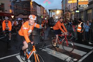 Participants in the Cycle Against Suicide make their way through town on Saturday night. Photo by Dermot Crean