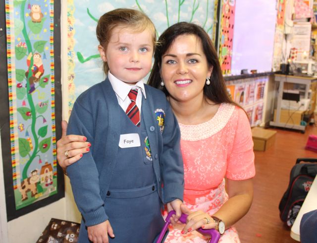 Faye O'Donoghue with mom Carol Anne at her first day in Scoil Eoin, Balloonagh on Wednesday morning. Photo by Dermot Crean