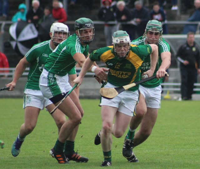 Daniel Collins breaks free from the challenge of Ballyduff players. Photo by Dermot Crean