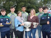 Teachers Aoife Costello and Rebecca Tobin holding the Tommy Markham Cup and the Minor B All-Ireland Hurling Cup with Kerry hurling and football minors Sean O'Donoghue, Tomas O'Connor, Stefan Okunbor, Kieran Dwyer and Niall O'Mahony at the CBS The Green Fun Run on Sunday afternoon. Photo by Dermot Crean
