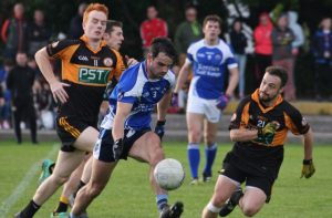 Action from the Semi-final of Coiste Thra Li Senior Football Championship between Austin Stacks and Kerins O'Rahillys. Photo by Adrienne McLoughlin. 