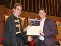 0564: Pictured receiving an Excellence Scholarship scroll and a cheque for Ä1,500 from NUI Galway President, Dr Jim Browne, is Donagh ” Buachalla from Clahane, Co. Kerry. Donagh is now studying Engineering at NUI Galway.