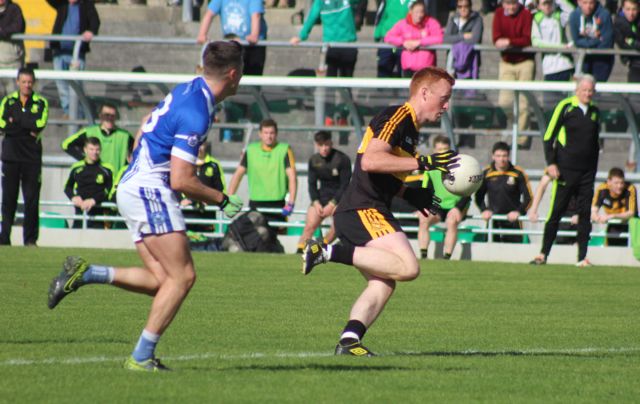Johnny Buckley on the run as Kieran O'Mahony chases. Photo by Dermot Crean