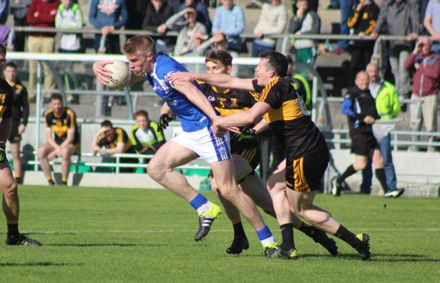 Tommy Walsh gets away from Gavin White and Alan O'Sullivan. Photo by Dermot Crean