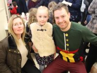 Marie, Ava and Philip Dewey at the Gaelscoil Mhic Easmainn Christmas Fair on Sunday. Photo by Dermot Crean