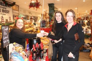 Ciara Lynch (left) hands out some mulled wine to Bridget Moore (right) with Clodagh Byrne at the Garveys Supervalu Food Fair and Wine Tasting event on Wednesday evening. Photo by Dermot Crean