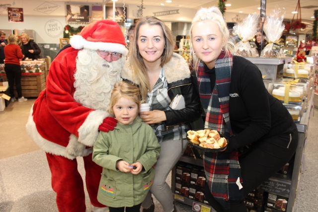 Santa with Hayley Powell, Mary Ellen Donovan and Chelsea Healy at the Garveys Supervalu Food Fair and Wine Tasting event on Wednesday evening. Photo by Dermot Crean