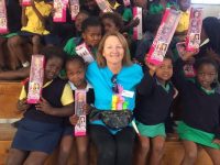 Pauline Barrett with children on one of her trips to South Africa with Mellon Educate.