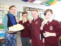 Teacher Evelyn Dore passes out the ice-cream to sixth class pupils Jamie Williams, Lilly O'Brien and Cillian O'Sullivan at Mercy Day at Moyderwell Primary School on Friday. Photo by Dermot Crean