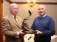 Chairperson of the Parents Council Noel Keenan makes a presentation to Austin Ó Seachnasaigh to mark his retirement from his role as Principal of Gaelcholáiste Chiarraí. Photo by Dermot Crean