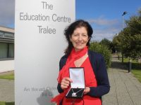 Caitríona Ní Chullota with a special gift from staff to mark her retirement as Director of the Education Centre in Tralee. Photo by Dermot Crean