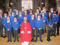 Bishop of Kerry Ray Browne with Brendan Smith's sixth class pupils from CBS Primary, Principal Denis Coleman and Fr Tadhg Fitzgerald and Sara Barry at the confirmations at St John's Church on Thursday. Photo by Dermot Crean