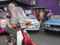 Trish Horan on a Honda 50 joined by members of the Kingdom Veteran Vintage & Classic Car Club looking forward to the 10th Ballymac Vintage Run later this month. Photo by Dermot Crean