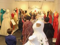 Some of those admiring the 'Gowns Of Glory' Exhibition at Kerry County Museum on Friday evening. Photo by Dermot Crean