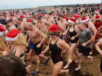 Heading back for more punishment at the Christmas Day swim in Fenit. Photo by Dermot Crean
