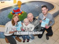 Colin 'Poshey' Aherne (right) with little Amber O'Connor and her dad Danny and Caroline Corkery (left) launching the fundraising Swimathon which takes place next month. Photo by Dermot Crean