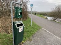 The dog foul dispenser on the canal walkway.