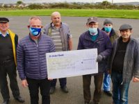 Ger McDonnell (front left) presents a cheque for €2,300 to members of Tralee Men's Shed on Tuesday. Included is Karl Spangler, Tony McMahon, Tony Moriarty, Denis Keane and Liam Gunn. Photo by Dermot Crean