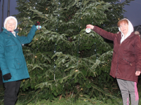 Sharon Roche (right) with her mom Philomena Duggan at the Remembrance Tree at Princes Quay. Photo by Dermot Crean