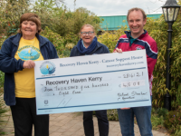 Tina Cunningham and Kathlen Collins accepting a cheque of €4,508 from Míchéal Sheehan the money was raised by Michéal by running a marathon. Photo: Joe Hanley