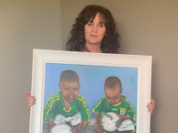 Maureen O'Mahony with her painting she has donated for a raffle in aid of Tír na nÓg Orphanage.
