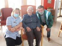 Rose O'Doherty (centre) with Care Assistant Anne Carey and bus driver Noel Conway at Baile Mhuire Day Care Centre on Wednesday. Photo by Dermot Crean