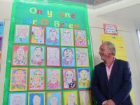Retiring Principal of Holy Family NS, Ed O'Brien, looks at some of the pupils portraits of him at the school on Wednesday. Photo by Dermot Crean