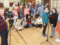 Pat Donegan records Presentation Primary School  pupils taking part in a music video for their own song, “Fight Another Day”. Also included is teacher Helena Hennessy and Principal John Hickey. Photo by Dermot Crean