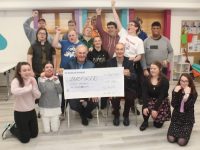 Joe Moriarty and Ray Moynihan presented a cheque for €8,200 to the Inspired Group at their centre in Brandon Place on Friday. Photo by Dermot Crean
