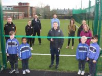 Ciara Griffin officially opens the new astroturf facility at CBS Primary School on Tuesday. Also included is Principal Denis Coleman, Kieran Donaghy of PST, with teaching staff and pupils. Photo by Dermot Crean