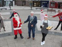 Launching Christmas In Tralee on Tuesday morning in The Square were Santa Claus with Mayor Of Tralee Johnnie Wall and Isabelle Lynch of John Dough's. At back is Niamh Hanley of Effigy with Brendan Culloty and Jean Foley of Tralee Municipal District with David Scott of Tralee Chamber. Photo by Dermot Crean