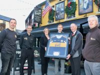 Fiona Kirby accepts a framed Austin Stacks jersey from Chairman of Austin Stacks, Billy Ryle at Kirbys Brogue Inn on Friday. From left; Mikey Collins of Austin Stacks seniors coaching staff; Brian Morgan and Fiona Kirby of the Brogue, Stacks player Shane O'Callaghan, Chairman of Austin Stacks Billy Ryle and Vice-Chairman Eamonn O'Reilly. Photo by Dermot Crean