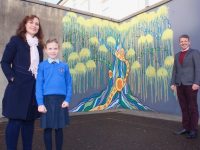 Sharon Mulhall and daughter Siún with Principal of Presentation Primary School John Hickey in front of the 'Tree Of Knowledge' mural at the school. Photo by Dermot Crean