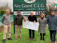 Joe Clifford, whose horse Oreo, won the Na Gaeil Gold Cup at their annual Race Night recently, being presented with a cheque for €1,000 by club treasurer Cathy Carey. Also in picture are Race Night committee members Colm O'Súilleabháin, Donal Lucey, and Tim Lynch Snr. Joe was delighted that his horse won the big race as was the trainer Noah Clifford and the jockey Aoileann Clifford.